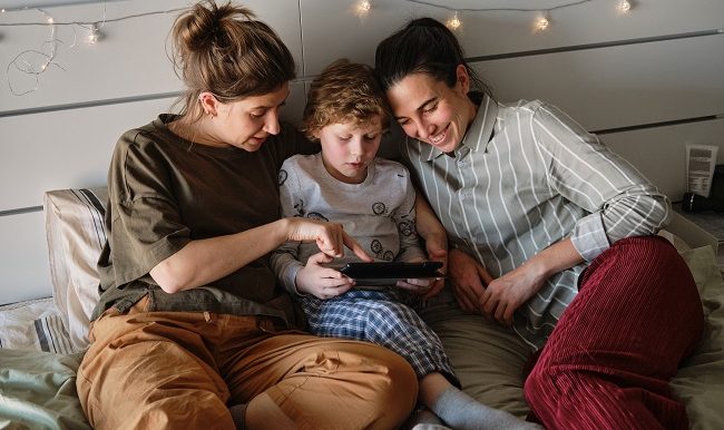 Family using digital tablet together